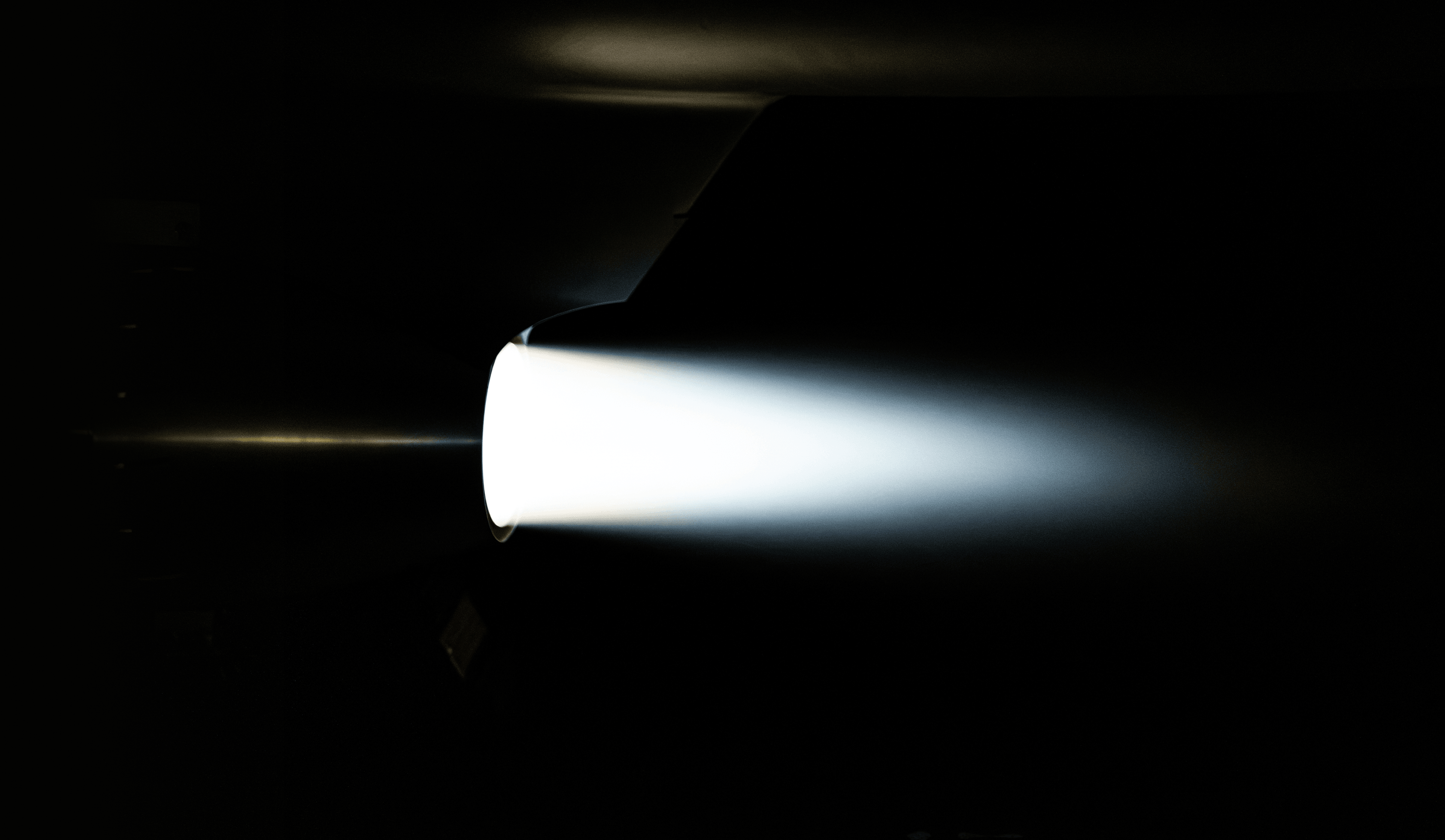 A Covenant aircraft photographed in near-total darkness.
